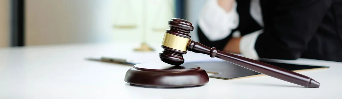 Gavel on a wooden block — symbolizing regulatory requirements and compliance in the context of IDMP and SAP technology.